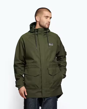 A man wearing a dark green Penfield winter jacket with dark jeans