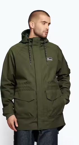 A man wearing a dark green Penfield winter jacket with dark jeans
