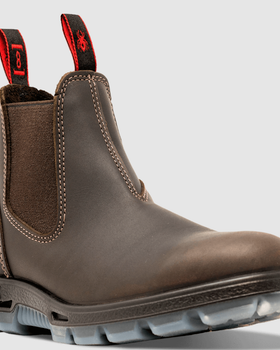 A pair of brown Redback slip-on workboots