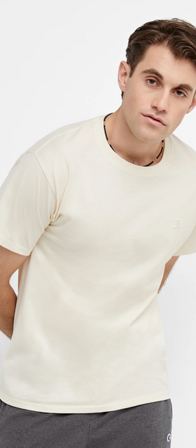 A man wearing a white Champion t-shirt