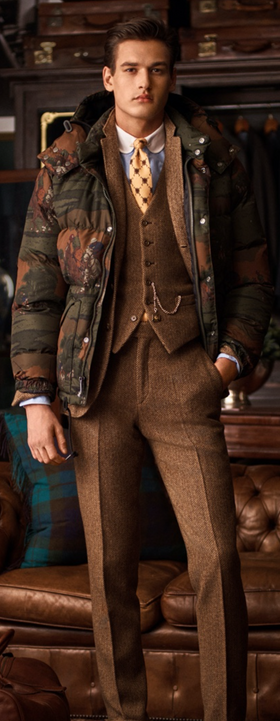 A man wearing a formal Polo Ralph Lauren outfit in different tones of brown
