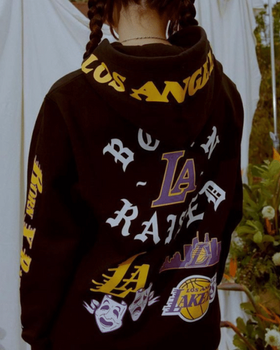 A man wearing a LA lakers Born x Raised hoodie