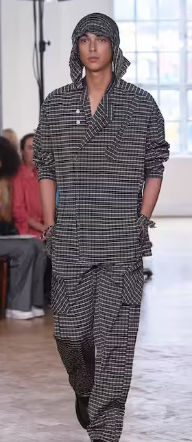 A woman wearing a Yeezy dark grey outfit