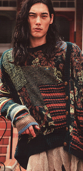 A man wearing a colorful Vivenne Westwood sweater