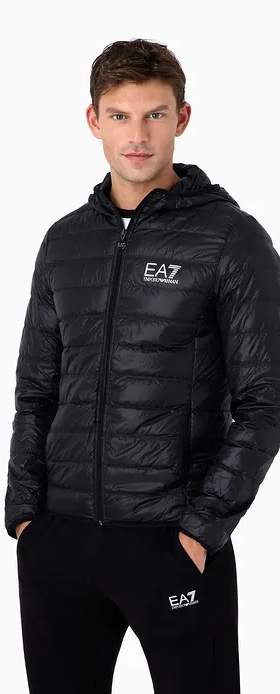 A man wearing an emporio armani light green leath jacket with black pants
