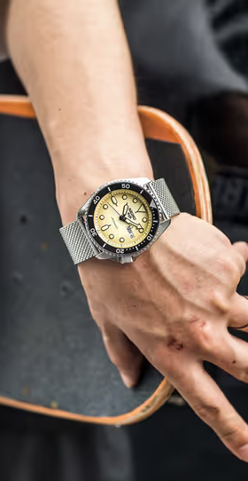 A man wearing a silver Seiko
