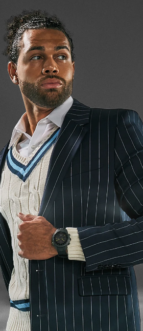 A man wearing a Garmin watch and a suit
