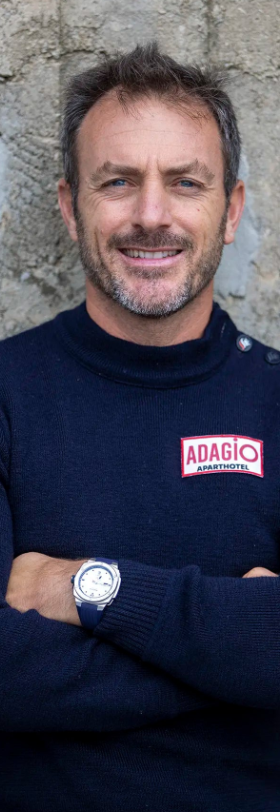 A man wearing an Alpina silver watch