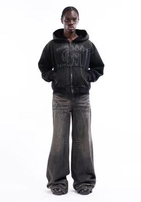 A man wearing split zip jacket used black