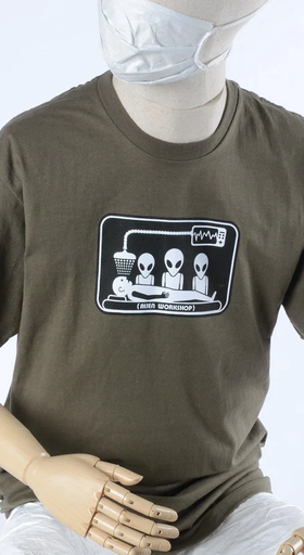 A mannequin wearing olive green abduction t-shirt