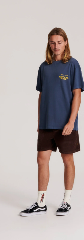 A man wearing director tee in Navy by The Critical Slide Society