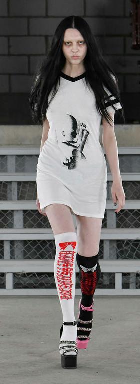 A woman wearing Ashley Williams baby varsity t dress