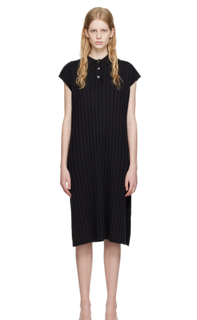 A woman wearing HOPE black nad midi dress