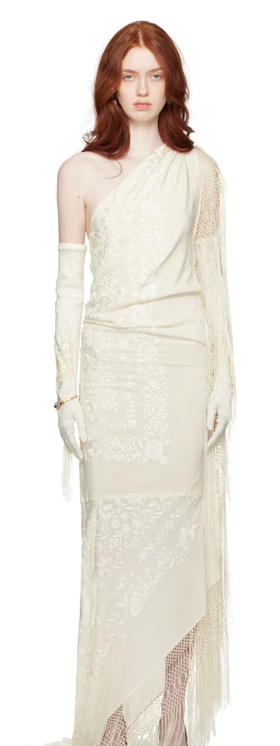 A woman wearing CONNER IVES off-white piano shawl maxi dress