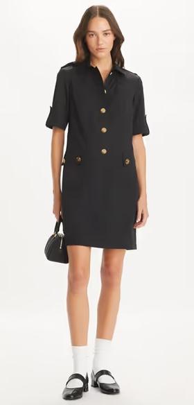 A woman wearing Tory Burch black camp dress